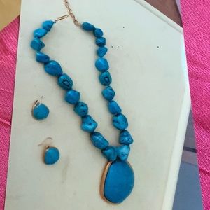 Turquoise colored necklace and earrings